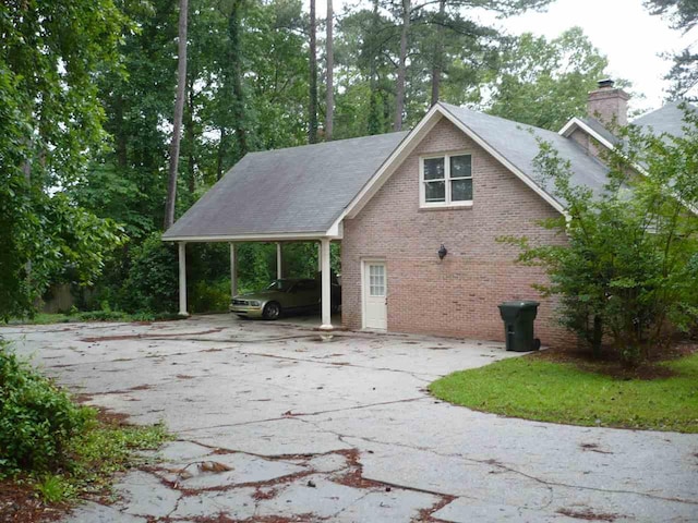 exterior space with a carport