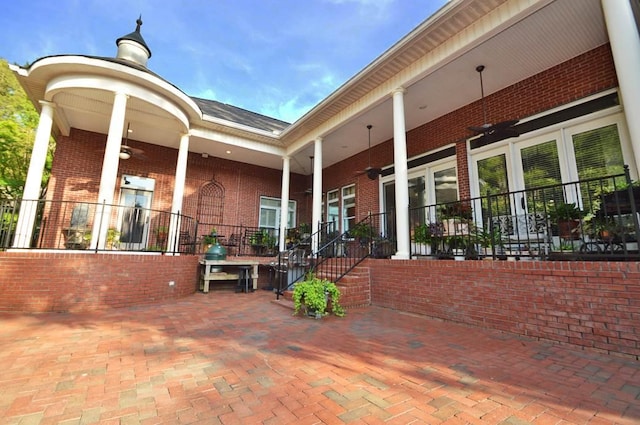 view of terrace featuring covered porch and ceiling fan