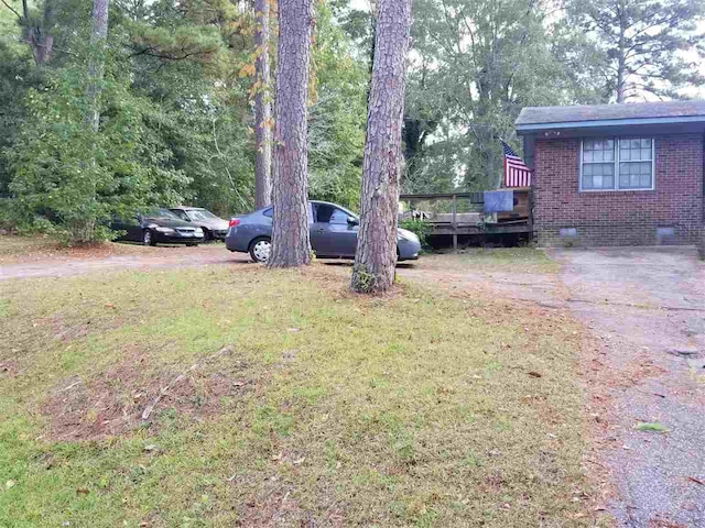 view of yard featuring a wooden deck