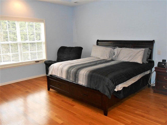 bedroom featuring light wood-type flooring