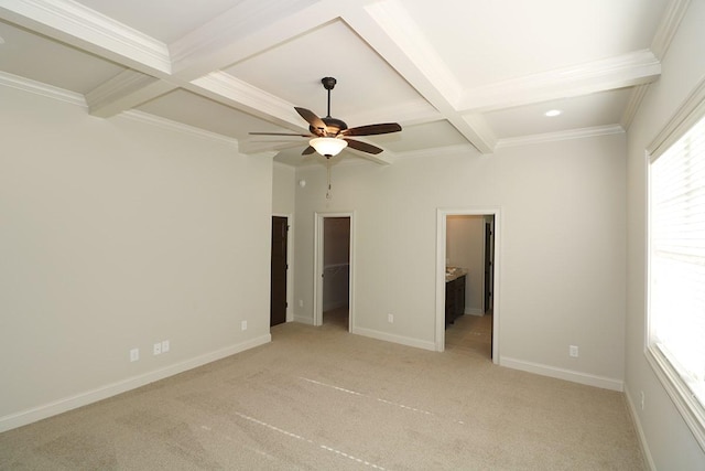 unfurnished bedroom with ceiling fan, a closet, coffered ceiling, light carpet, and a spacious closet