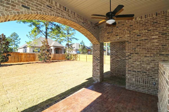 exterior space featuring ceiling fan