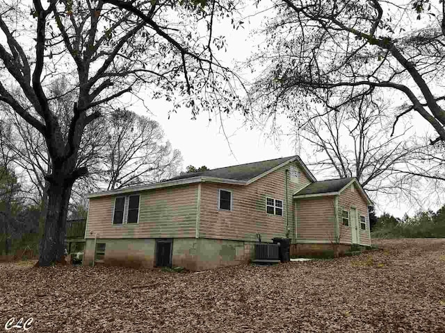 view of property exterior featuring central AC