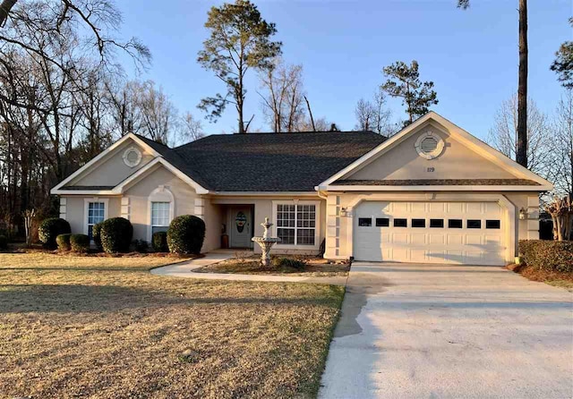 single story home featuring a garage