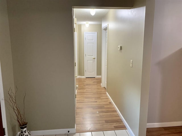 hall with light wood-type flooring