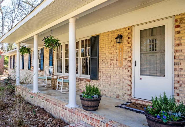 property entrance with covered porch