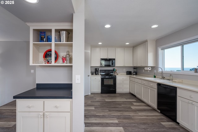 2131 Beach Loop Dr, Bandon, OR 97411 - kitchen featuring black appliances, a sink, white cabinetry, recessed lighting, and dark wood-style flooring