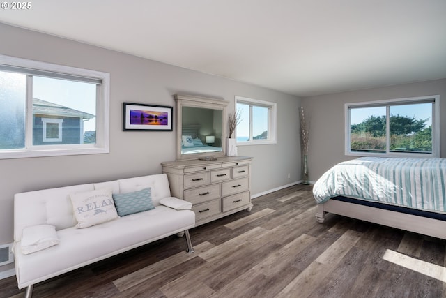 2131 Beach Loop Dr, Bandon, OR 97411 - bedroom featuring visible vents, wood finished floors, and baseboards