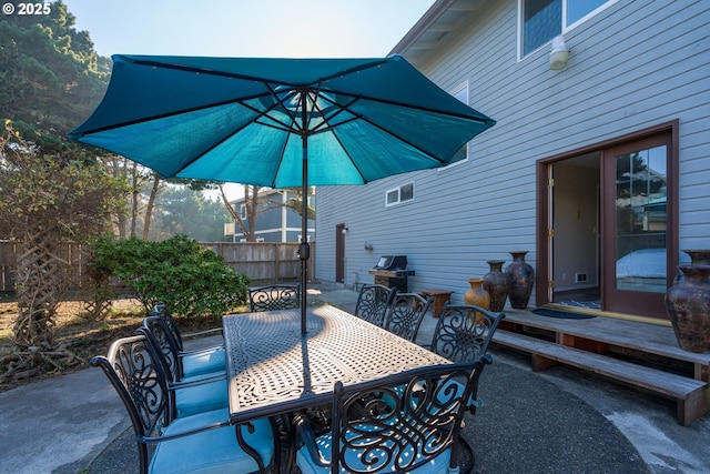 2131 Beach Loop Dr, Bandon, OR 97411 - view of patio featuring outdoor dining space and fence