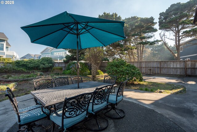 2131 Beach Loop Dr, Bandon, OR 97411 - view of patio / terrace featuring a fenced backyard and outdoor dining space