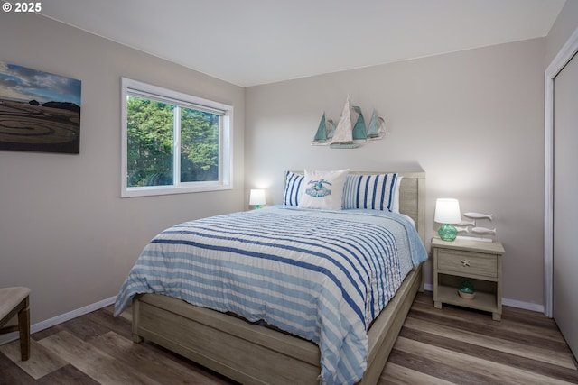 2131 Beach Loop Dr, Bandon, OR 97411 - bedroom with baseboards and wood finished floors