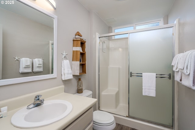 2131 Beach Loop Dr, Bandon, OR 97411 - bathroom featuring vanity, toilet, and a shower stall