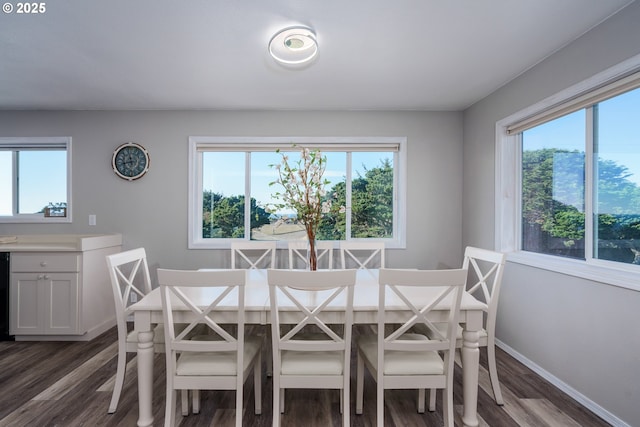 2131 Beach Loop Dr, Bandon, OR 97411 - dining area featuring baseboards and dark wood-style floors