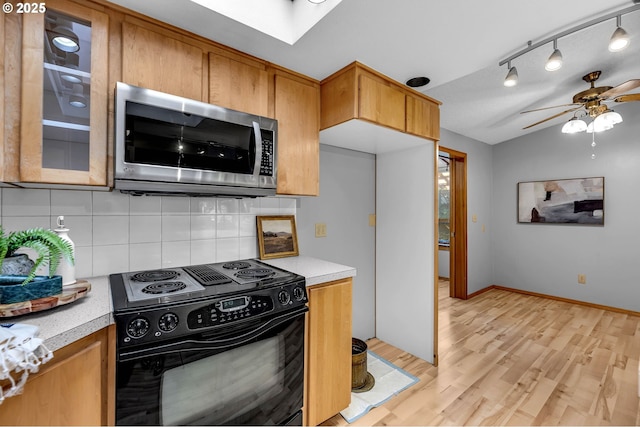 602 SE 130th Ct, Vancouver, WA 98683 - kitchen featuring stainless steel microwave, black electric range oven, light countertops, ceiling fan, and lofted ceiling
