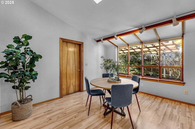 602 SE 130th Ct, Vancouver, WA 98683 - dining space with wood finished floors, vaulted ceiling, and baseboards