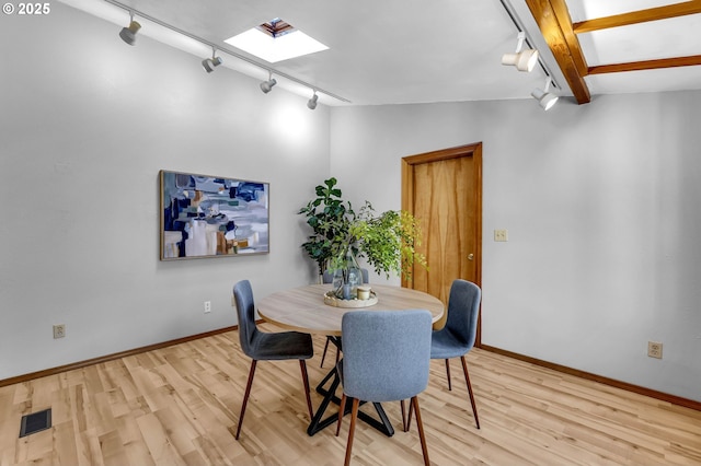 602 SE 130th Ct, Vancouver, WA 98683 - dining space featuring track lighting, wood finished floors, a skylight, and baseboards