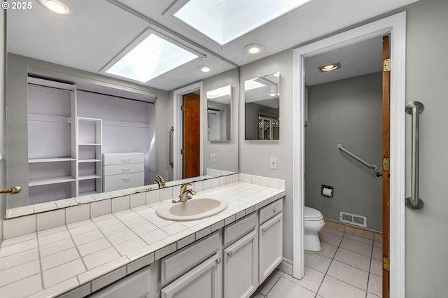 602 SE 130th Ct, Vancouver, WA 98683 - bathroom with toilet, tile patterned flooring, vanity, recessed lighting, and baseboards