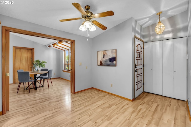 602 SE 130th Ct, Vancouver, WA 98683 - foyer entrance with light wood-style flooring, lofted ceiling, baseboards, and a ceiling fan