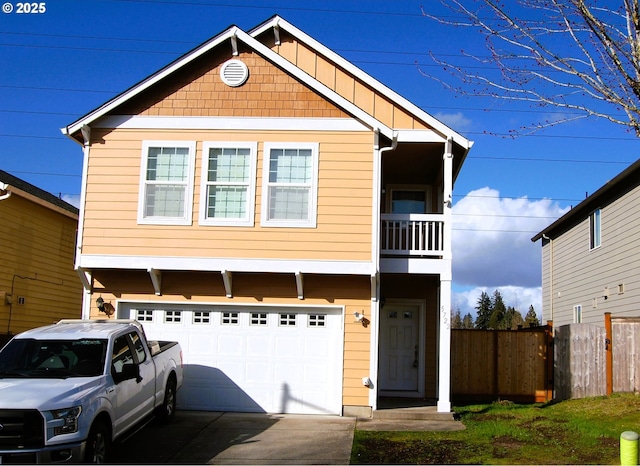 view of front of home with driveway, an attached garage, and fence