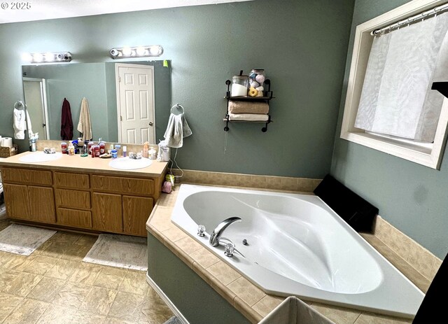 full bath featuring a garden tub, a sink, a shower with door, and double vanity