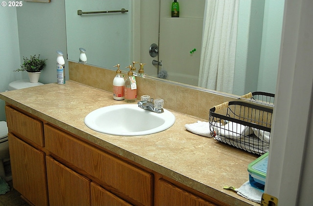 full bathroom with a shower with curtain and vanity