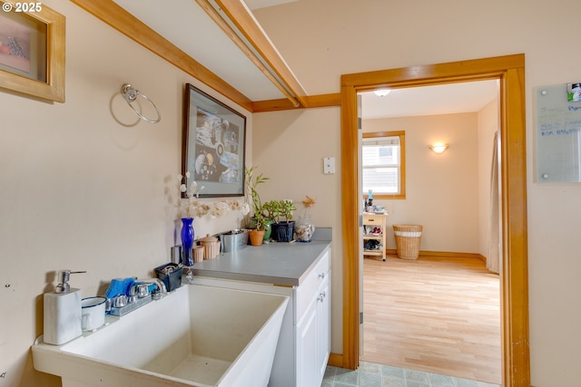 bathroom with sink and hardwood / wood-style floors