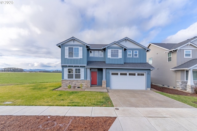 craftsman house featuring a garage and a front yard