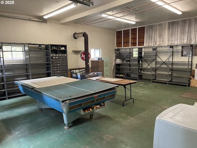recreation room featuring concrete flooring