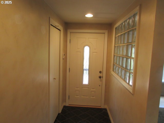 10285 S Rosewood Way, Molalla, OR 97038 - entryway with dark tile patterned flooring and baseboards