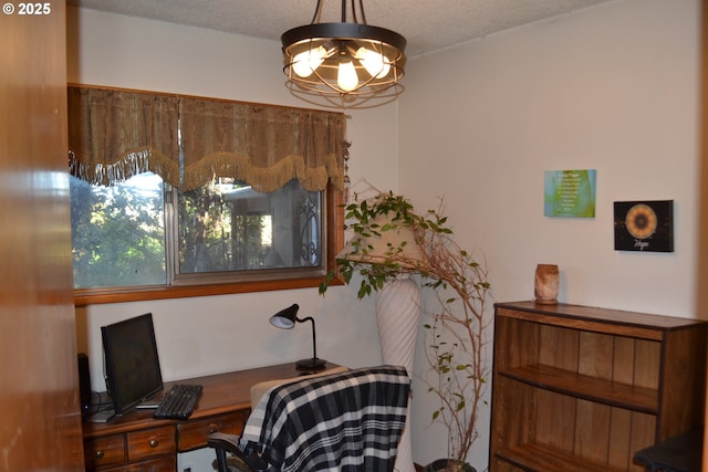 home office featuring a textured ceiling