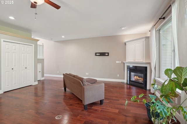 1705 SE 111th Ct, Vancouver, WA 98664 - living room featuring a fireplace with flush hearth, a ceiling fan, baseboards, and recessed lighting