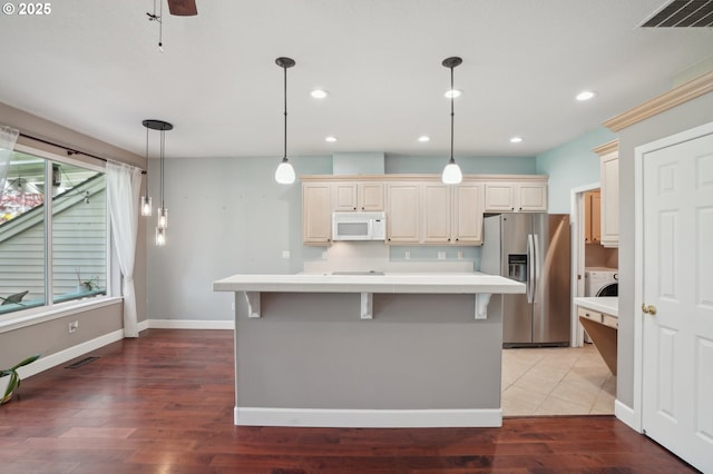 1705 SE 111th Ct, Vancouver, WA 98664 - kitchen featuring a center island, stainless steel fridge, washer / dryer, white microwave, and light countertops