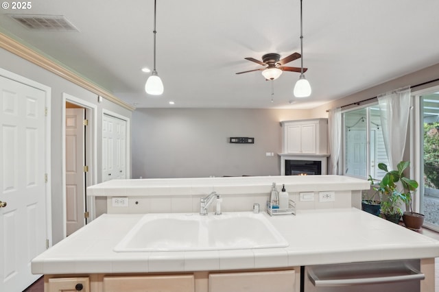 1705 SE 111th Ct, Vancouver, WA 98664 - kitchen with a ceiling fan, visible vents, a sink, and tile countertops