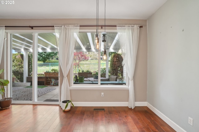 1705 SE 111th Ct, Vancouver, WA 98664 - unfurnished dining area with baseboards, a healthy amount of sunlight, hardwood / wood-style floors, and visible vents