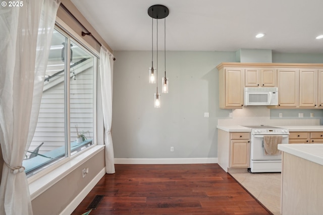 1705 SE 111th Ct, Vancouver, WA 98664 - kitchen with light countertops, visible vents, a healthy amount of sunlight, white appliances, and light wood-style floors