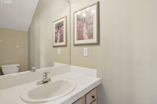 1705 SE 111th Ct, Vancouver, WA 98664 - half bathroom featuring toilet, lofted ceiling, and vanity