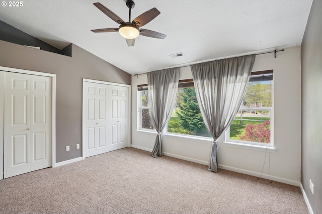 1705 SE 111th Ct, Vancouver, WA 98664 - unfurnished bedroom with carpet, lofted ceiling, multiple closets, visible vents, and a textured ceiling