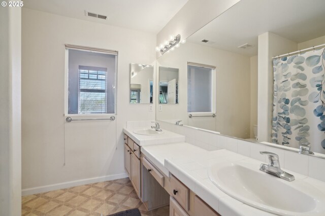 1705 SE 111th Ct, Vancouver, WA 98664 - bathroom with double vanity, visible vents, and a sink