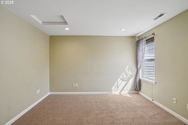 1705 SE 111th Ct, Vancouver, WA 98664 - spare room with attic access, baseboards, visible vents, and carpet