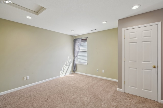 1705 SE 111th Ct, Vancouver, WA 98664 - carpeted spare room with attic access, baseboards, visible vents, and recessed lighting