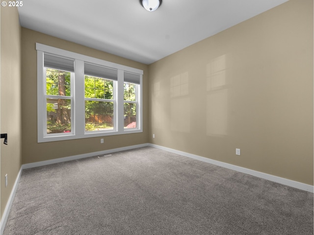 64911 E Mountain Meadow Ln, Rhododendron, OR 97049 - spare room featuring carpet floors and baseboards