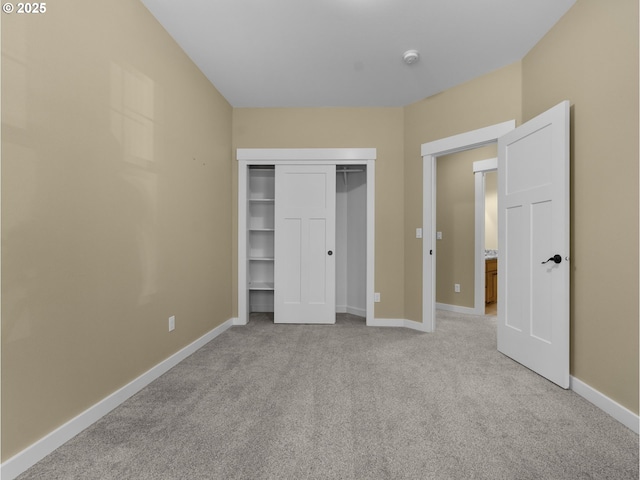 64911 E Mountain Meadow Ln, Rhododendron, OR 97049 - unfurnished bedroom with light colored carpet, baseboards, and a closet