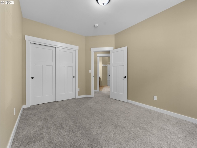 64911 E Mountain Meadow Ln, Rhododendron, OR 97049 - unfurnished bedroom featuring carpet flooring, a closet, and baseboards