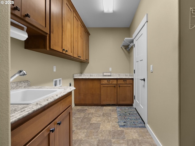 64911 E Mountain Meadow Ln, Rhododendron, OR 97049 - laundry room with hookup for a washing machine, cabinet space, stone finish floors, hookup for an electric dryer, and baseboards