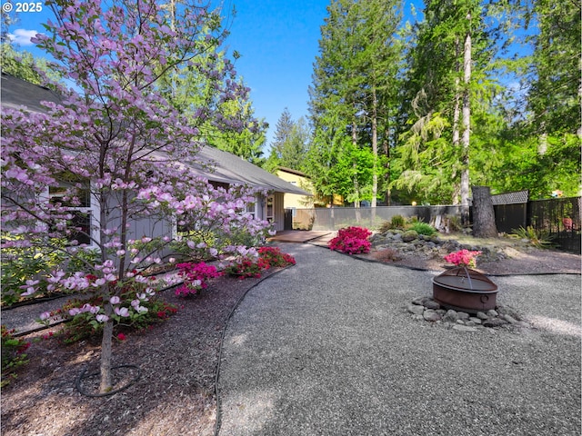 64911 E Mountain Meadow Ln, Rhododendron, OR 97049 - view of yard with a fire pit, fence, and a patio area