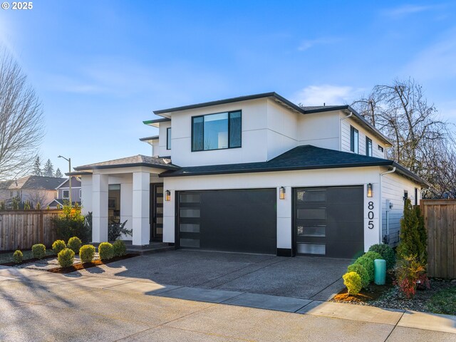 view of front of home featuring a garage and a front lawn