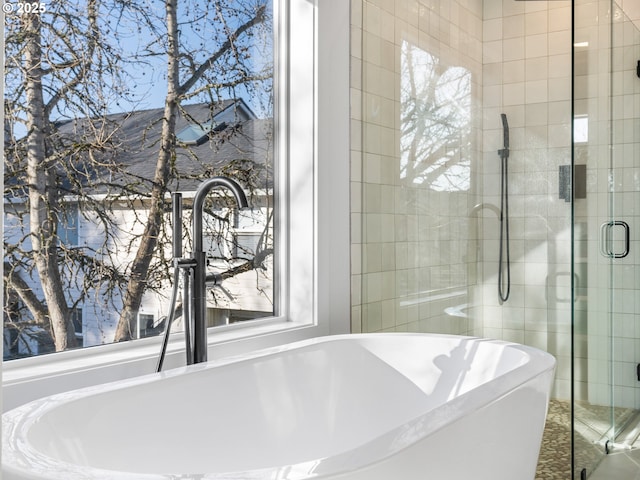 bathroom featuring independent shower and bath and sink