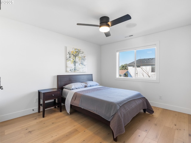 bedroom featuring light hardwood / wood-style flooring and ceiling fan