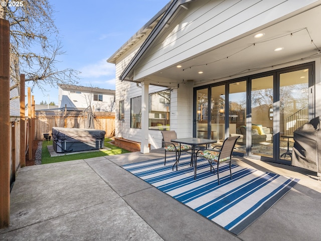 view of patio with a hot tub