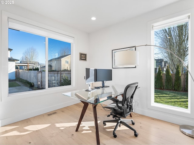 home office featuring light hardwood / wood-style floors